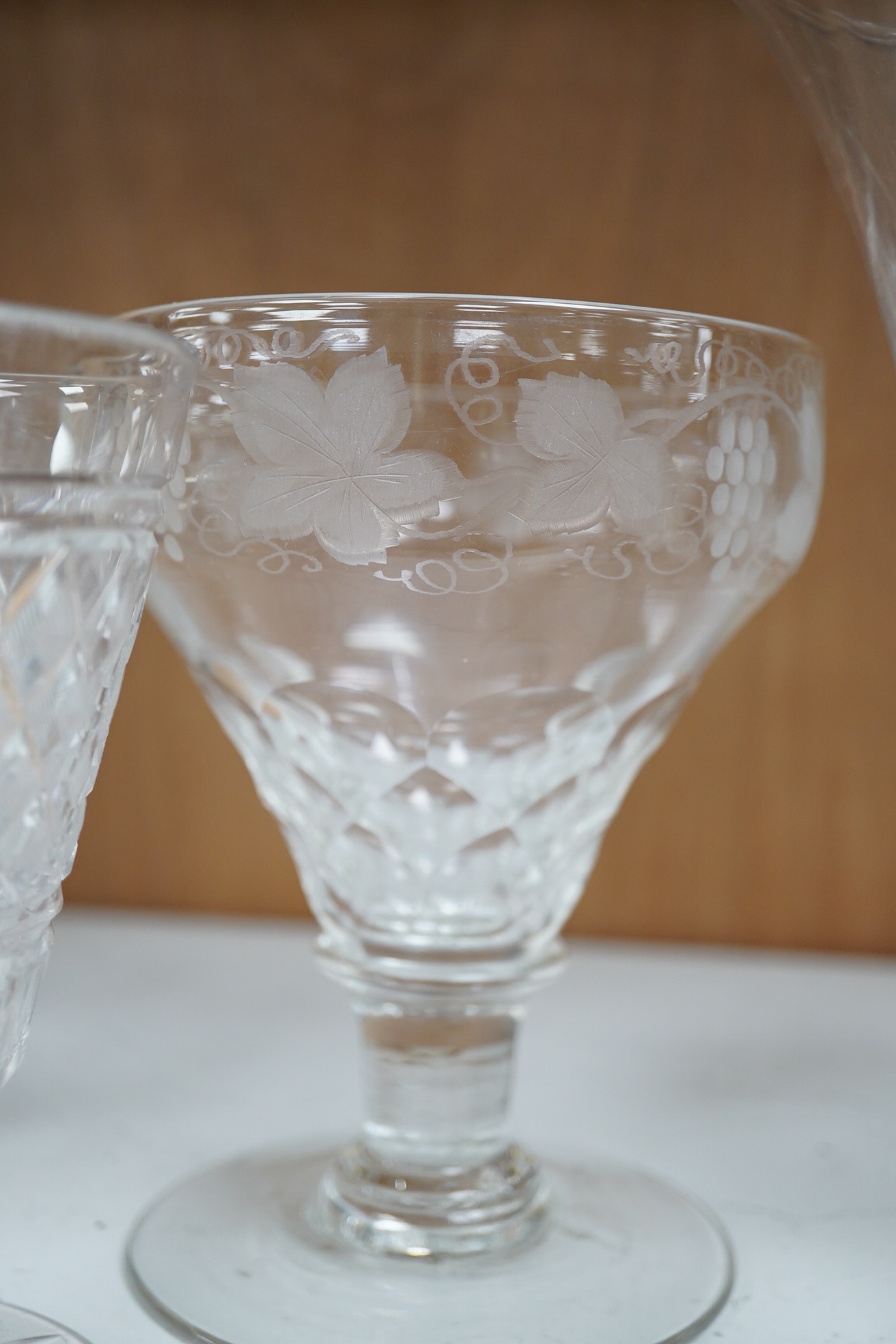 A George III tear drop cordial glass, a pair of hobnail cut bucket bowl rummers and a vineous engraved glass, tear drop glass 18cm high (5). Condition - good